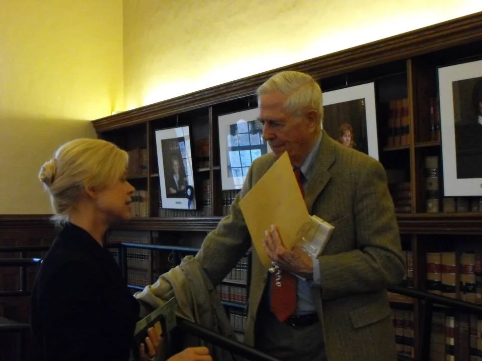 Martha Dean speaking with Judge James Buckley at a forum at the University of Connecticut School of Law in 2013.