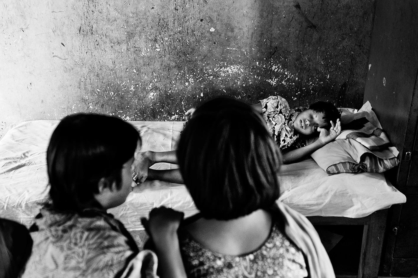 For many hours the girls just sit and wait on their beds. Read more