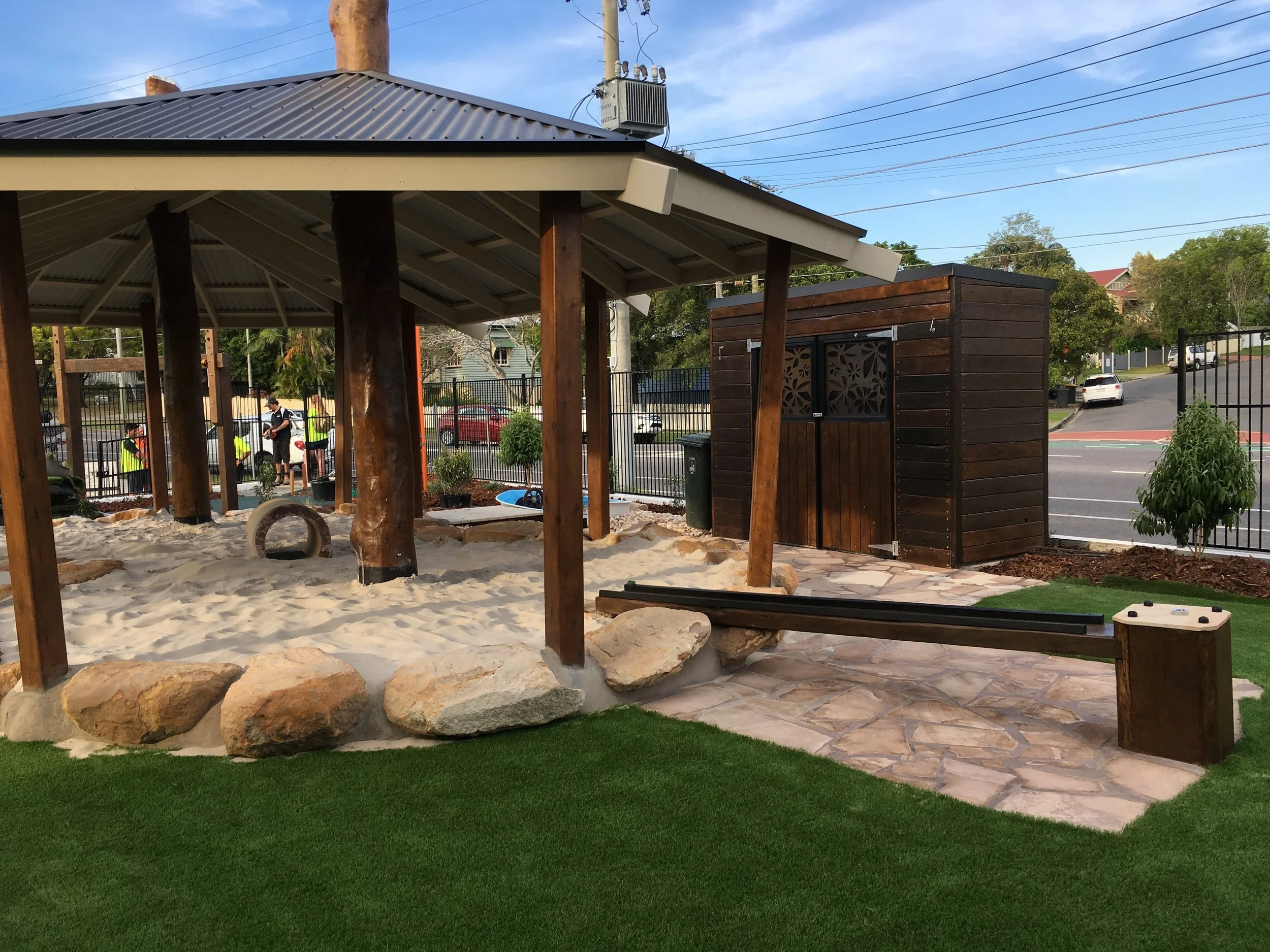 Double sand-pit with recycled timber water-course.