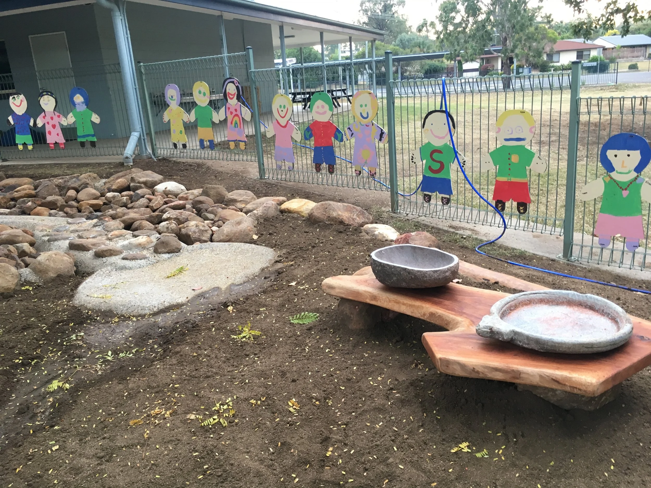 No point having a watercourse if it doesn't end up somewhere fun!! Stone bowls for making mud pies.