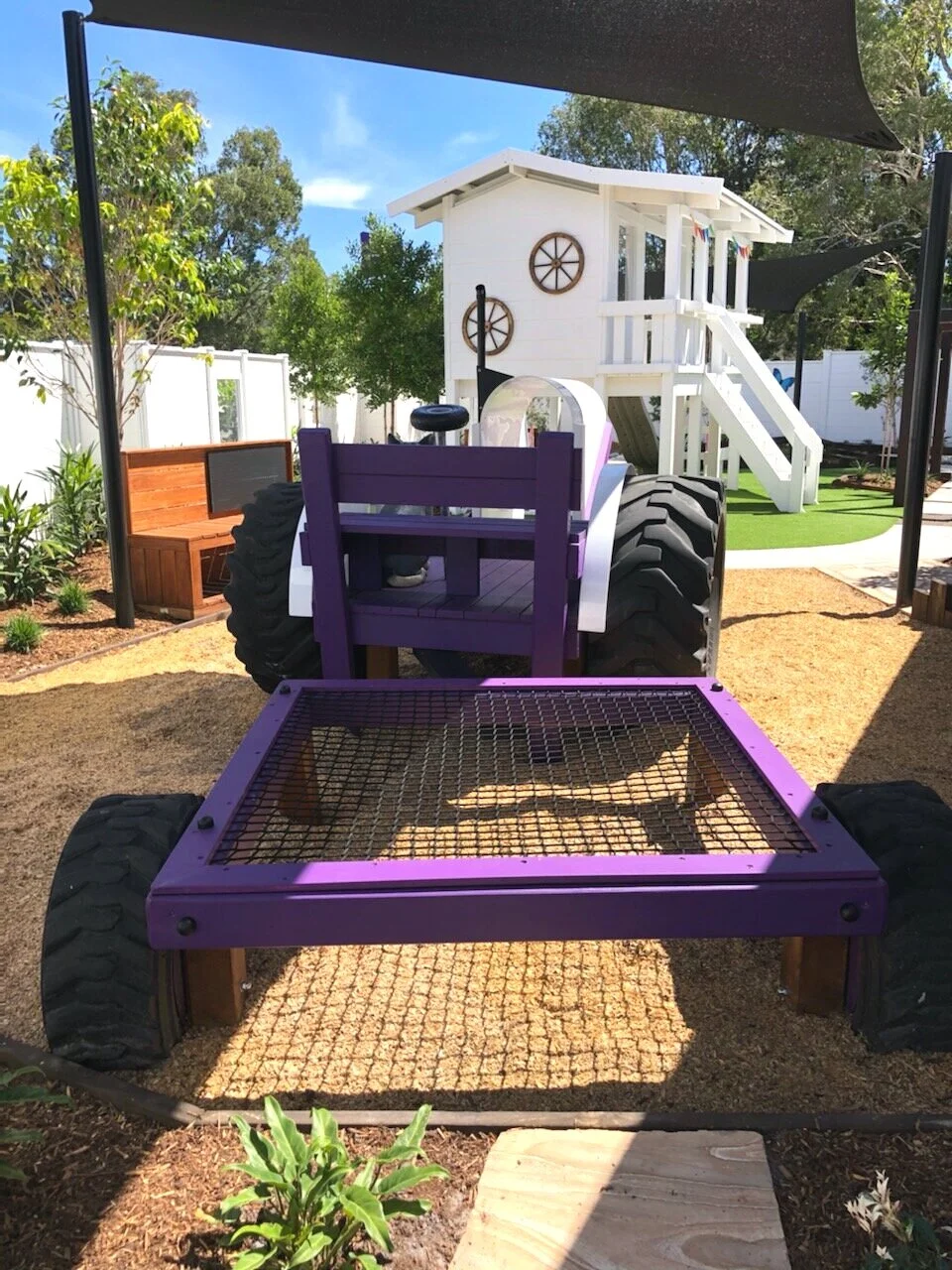 Tractor style playground feature