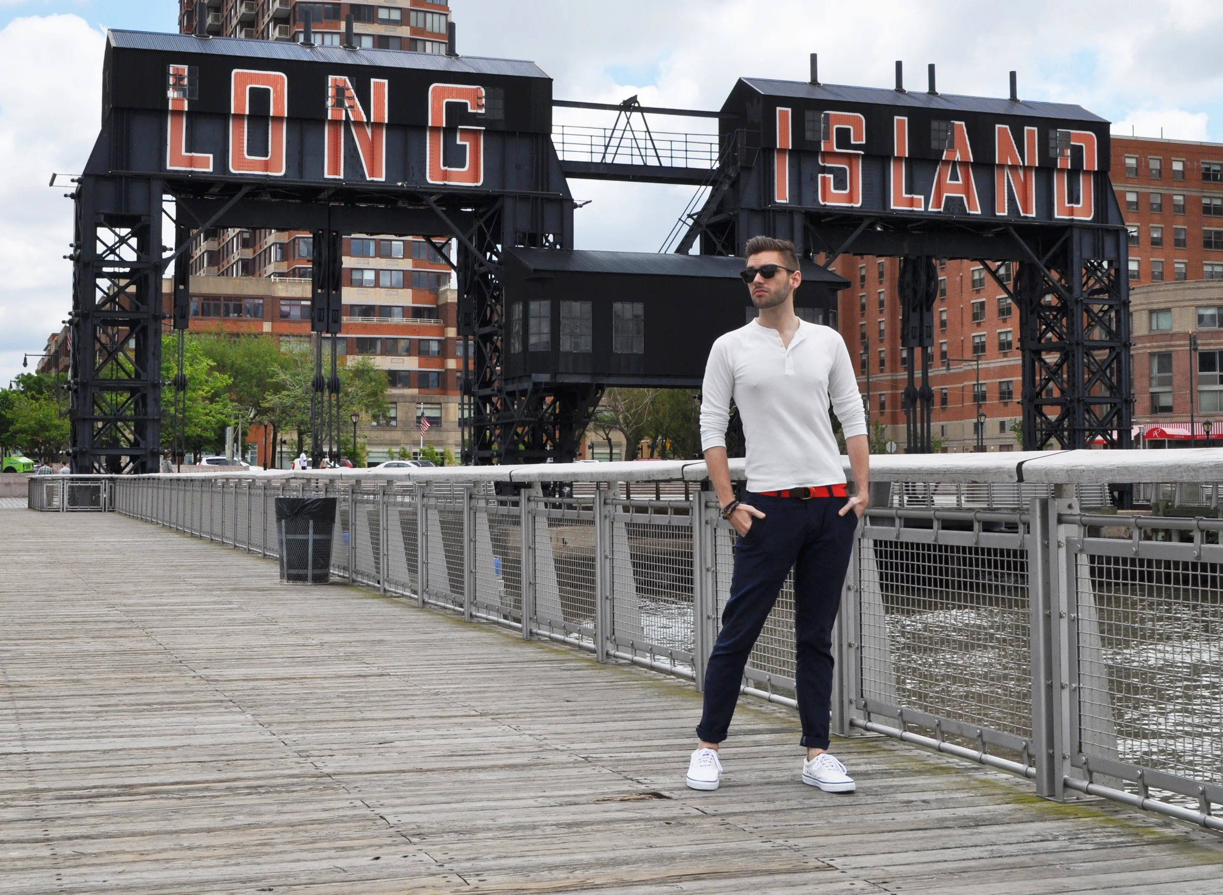It's Memorial Day weekend, so I'm wearing red, white and blue... Obviously. I avoided the stars and stripes though and kept to the basics: white henley, red/orange belt and these awesome blue linen pants from Selected . I'm decked out for a BBQ, picnic or stroll along the pier! Living in Astoria, it doesn't take long to get to a park with fantastic views of the city. At Hunters Point, Long Island City, there's this great stretch of pier and park overlooking the NY skyline. It comes complete with a soccer field, dog park, kid park and a little café. If it weren't so cloudy, I would have laid out on one of their wooden lounge chairs! You'll have to check it out if you're in the area. The views really can't be beat. What did you guys do with your holiday weekend? Photo Credit: Michael Georgen Club Monaco henley and belt / Selected linen pant / Sperry Top-Sider shoes / Giles and Brother S-hook bracelet
