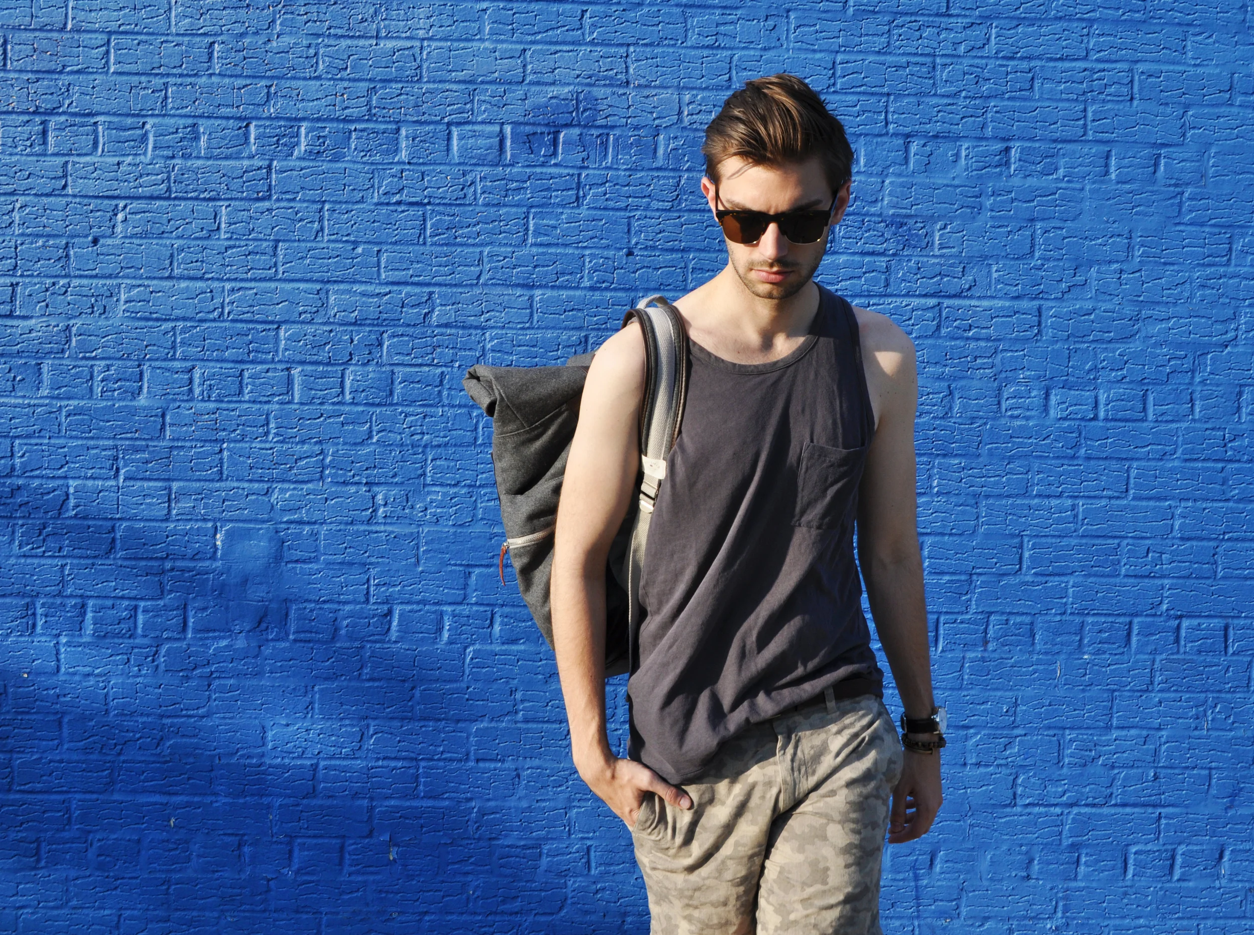 Today is definitely a "Skies out, thighs out" kinds of day. We're not in Fall yet and it has been a scorcher! I felt like a desert commando in my camo shorts and boots and this roll-top ASOS backpack brought the whole idea home. It's rugged and utilitarian and you can fit a ton of stuff in it. Tank tops and shorts are classic Summer fare, but the boots are what bring it to another level. Try mixing up your Summer footwear and you'd be surprised how much it can change your whole outfit. Oxfords, boat shoes, sneakers and boots. Each one says something different and it's the unexpected choice that is often the coolest. Heading to CT this weekend to take a break from the city heat. What are your plans to keep cool through the end of Summer? Club Monaco camo shorts ( similar ) / ASOS backpack ( similar ) / Banana Republic desert boots / Coach watch / Giles & Brother railroad spike cuff / Ettika bracelet / Warby Parker sunglasses