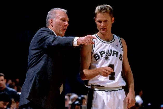 Kerr won two NBA championships (1999, 2003) while playing in San Antonio under Popovich