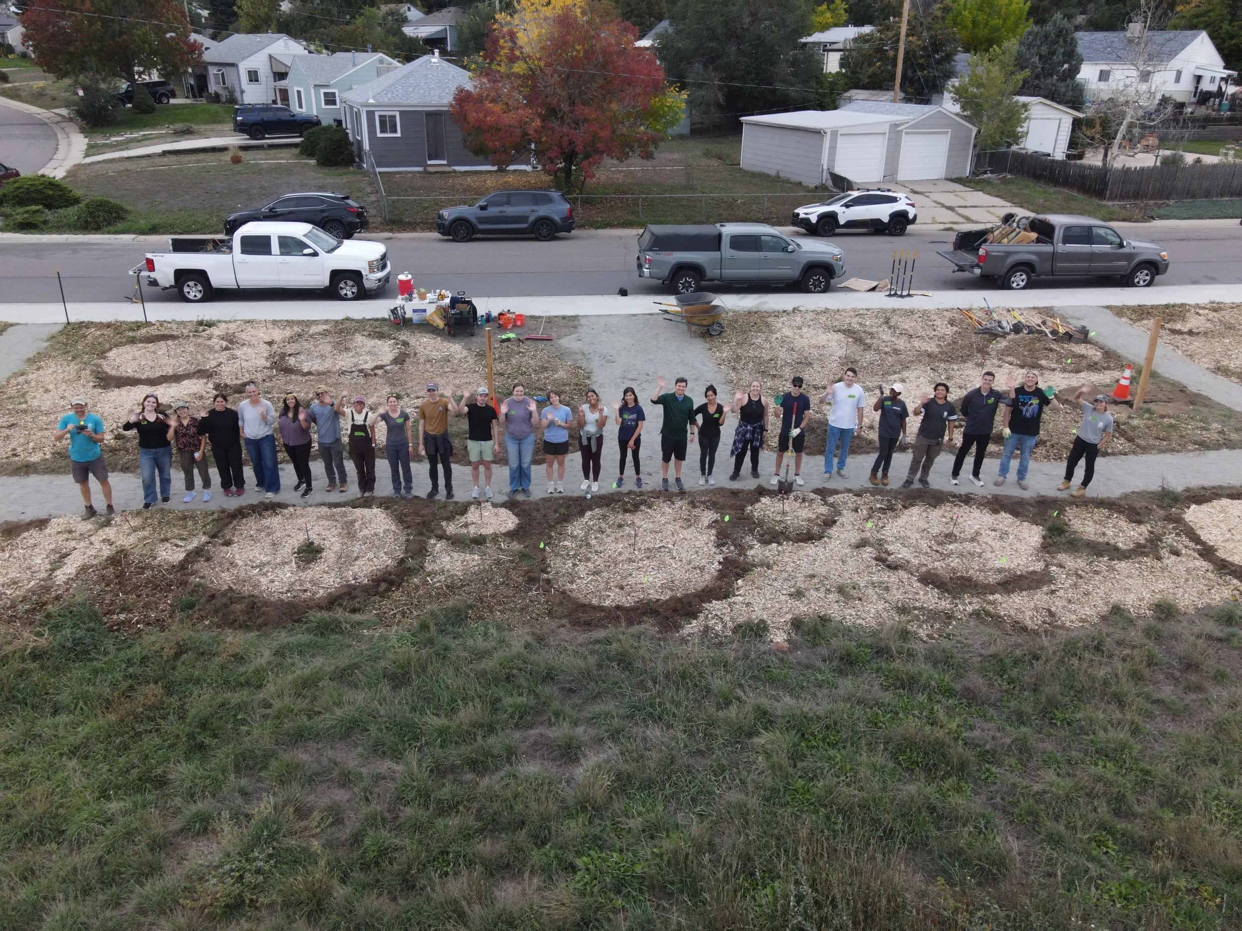 Aerial group photo at a garden building volunteer event.