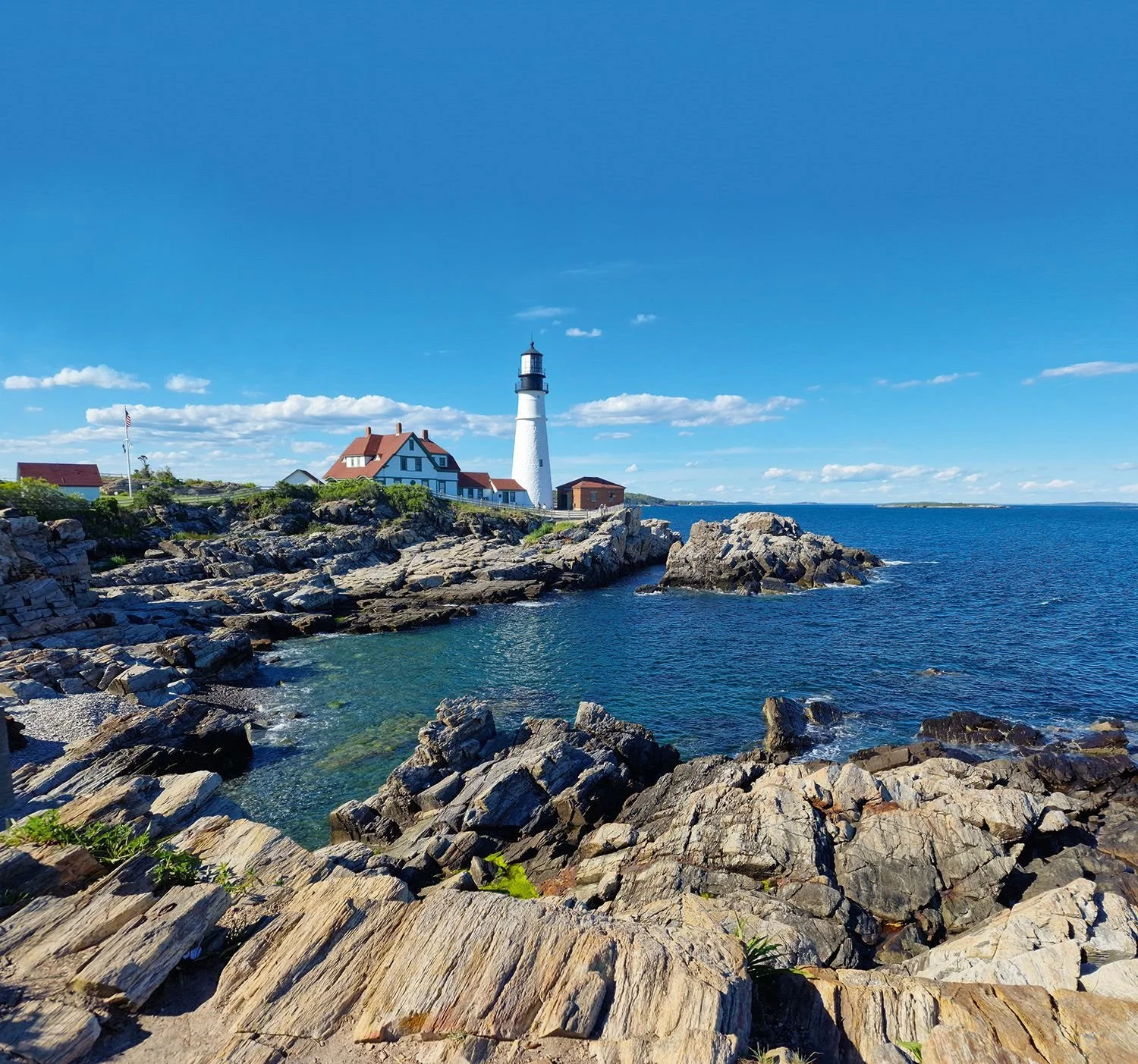 Coast of Maine featuring a lighthouse.
