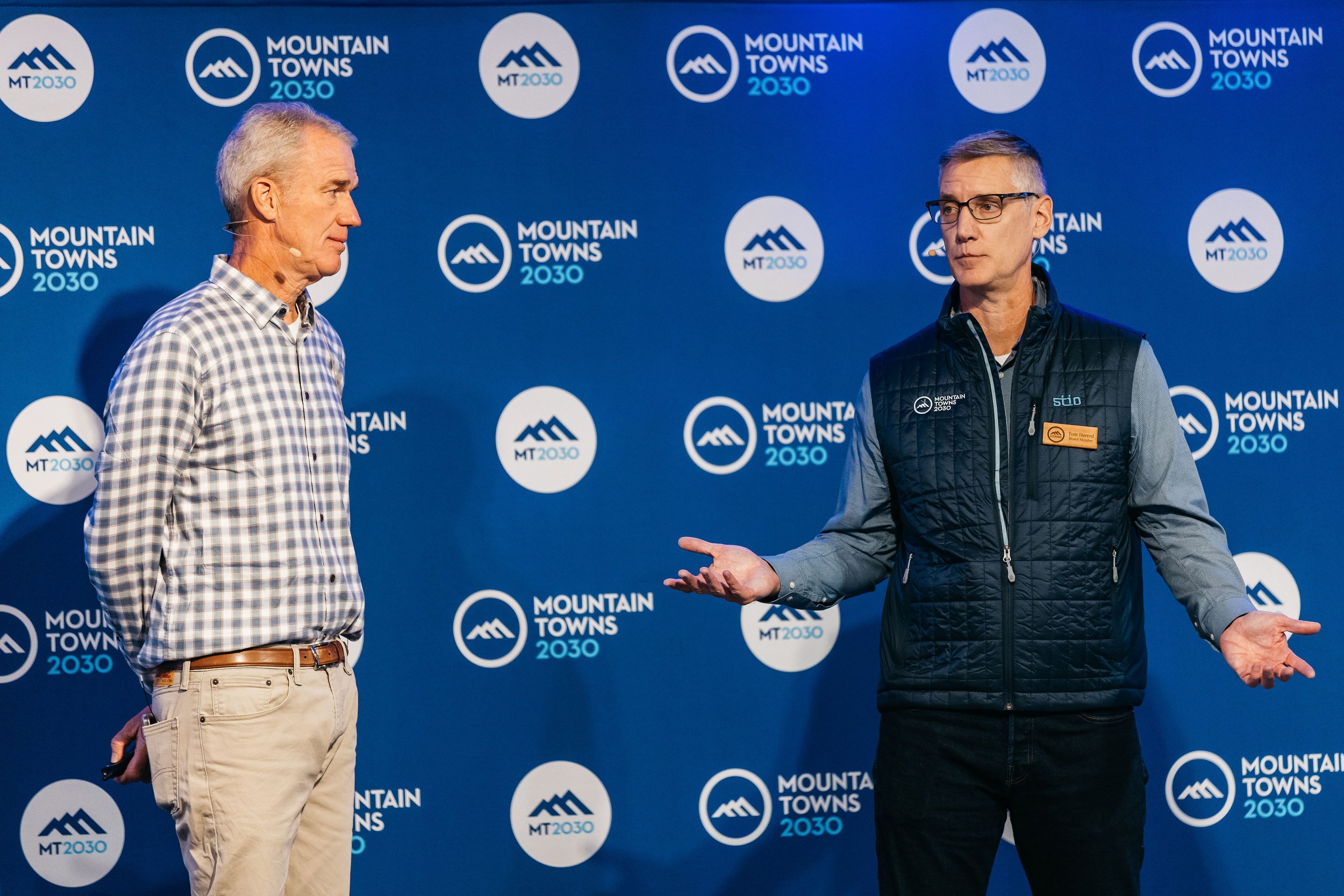 Tom Herrod speaking at MT 2030 event with branded backdrop..