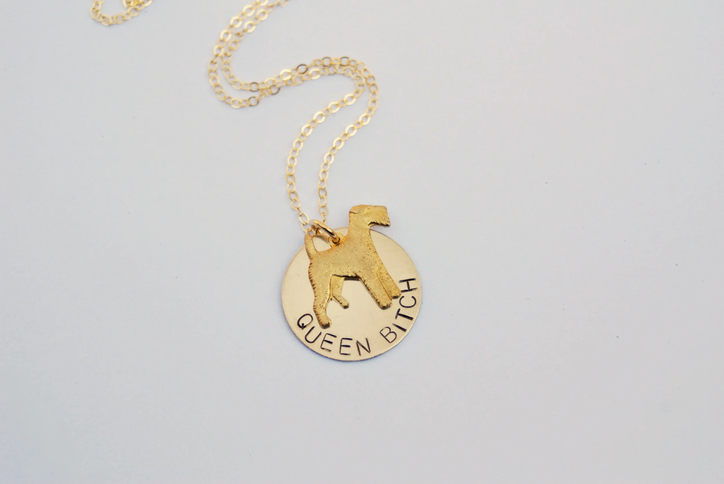 Because you’re top dog around here. This Queen Bitch Necklace has a solid brass, textured dog charm in the sassiest pose.