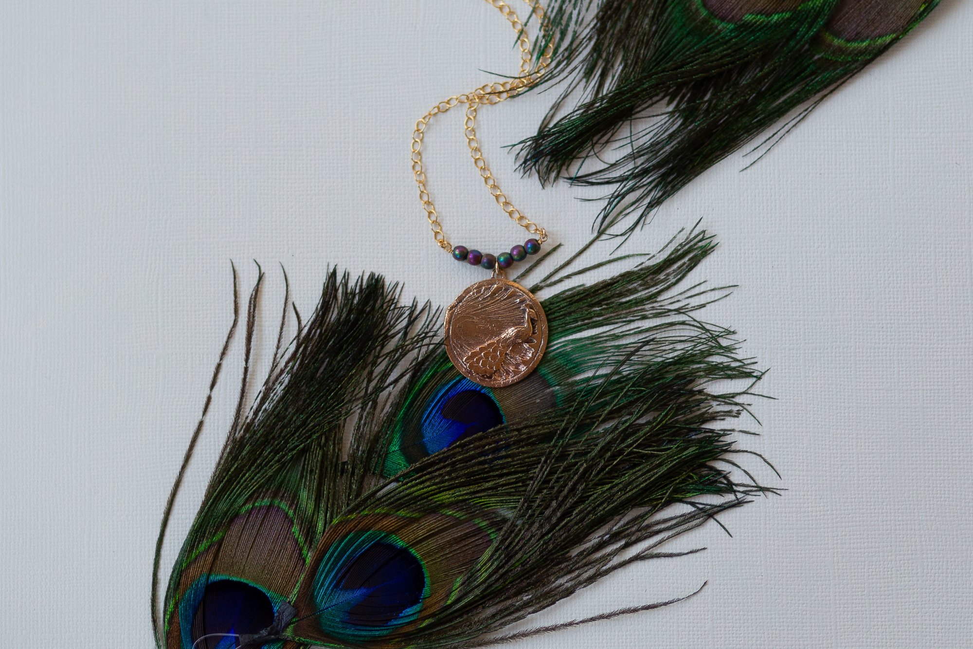Peacock Feather necklace with blue sapphires