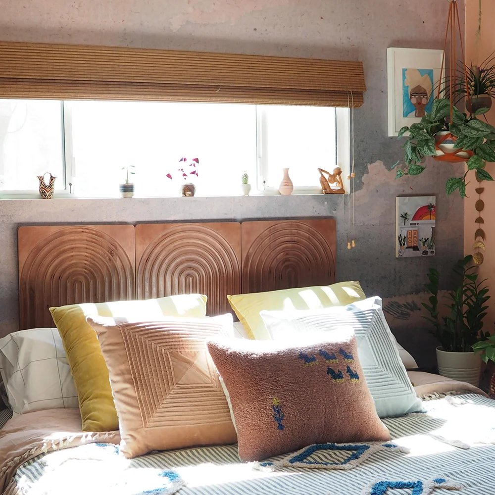 Wood carved wall panels used as a wall-mounted headboard.
