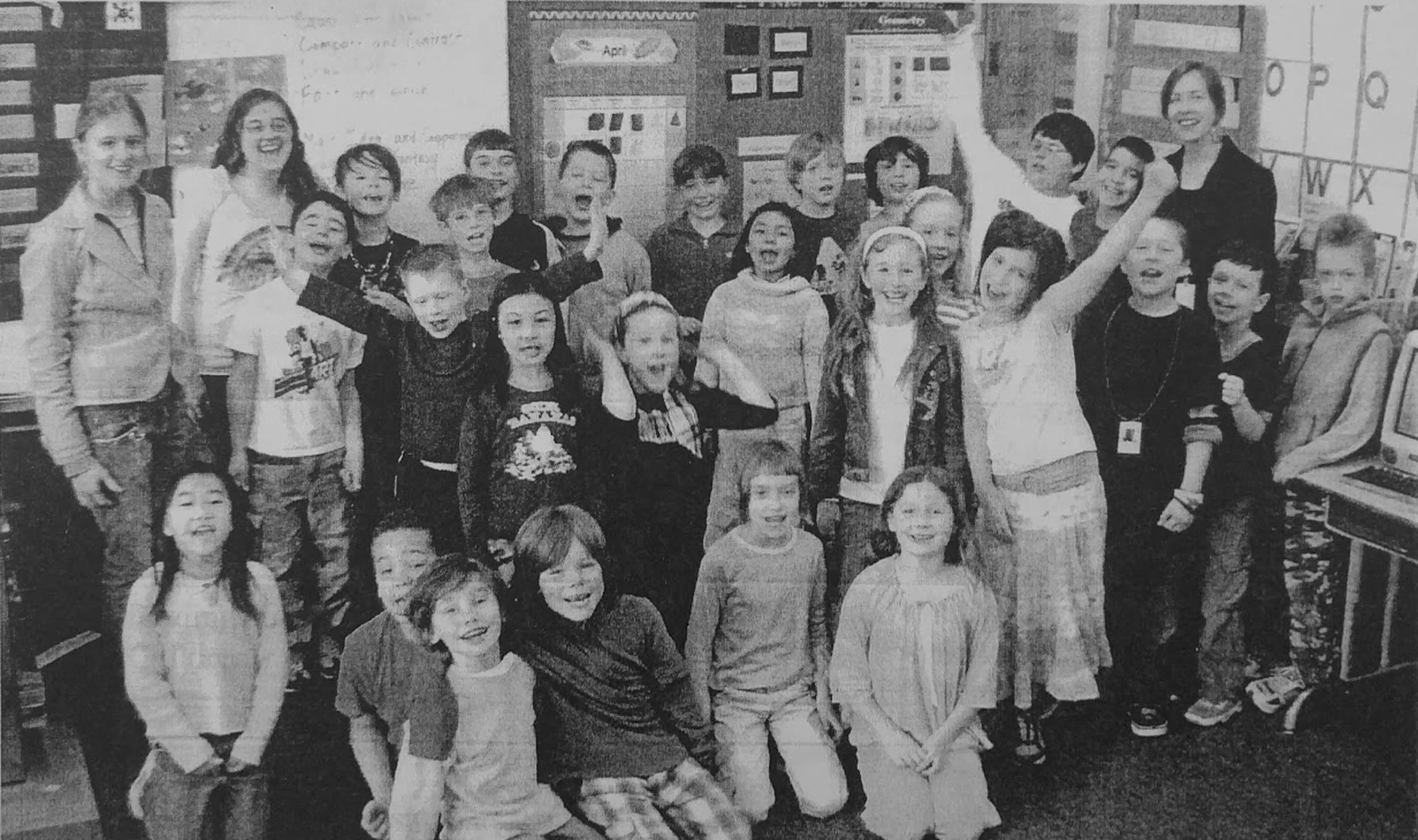 Lewis Elementary class with Reedie outreach teachers Casey Hurstell and Katherine Loera; this picture accompanied the class’ letters asking for further funding for Biology Outreach to continue in 2008. Courtesy of Special Collections, Eric V. Hauser Memorial Library, Reed College
