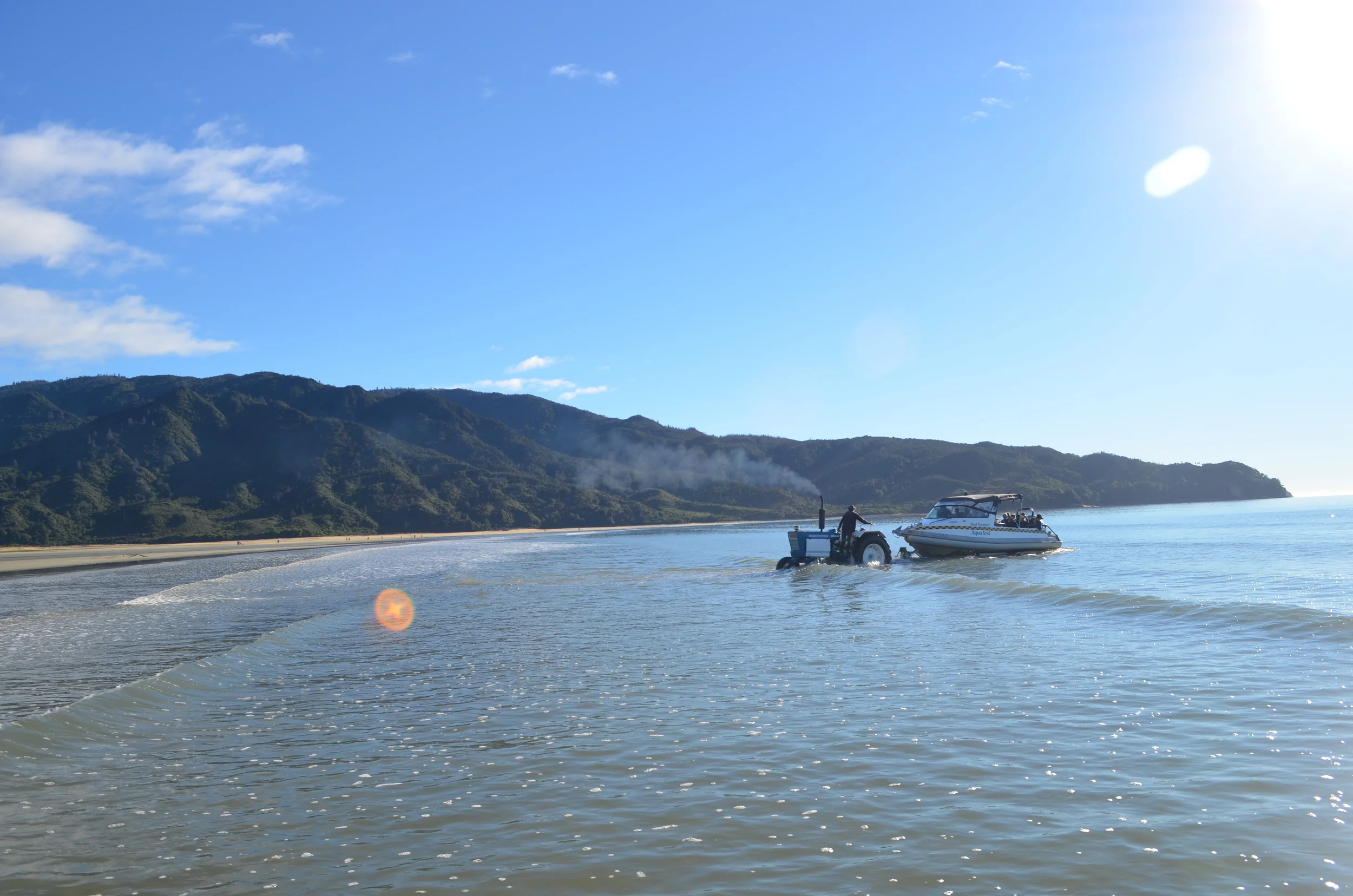 Tractors taking Aqua Taxis out to sea.