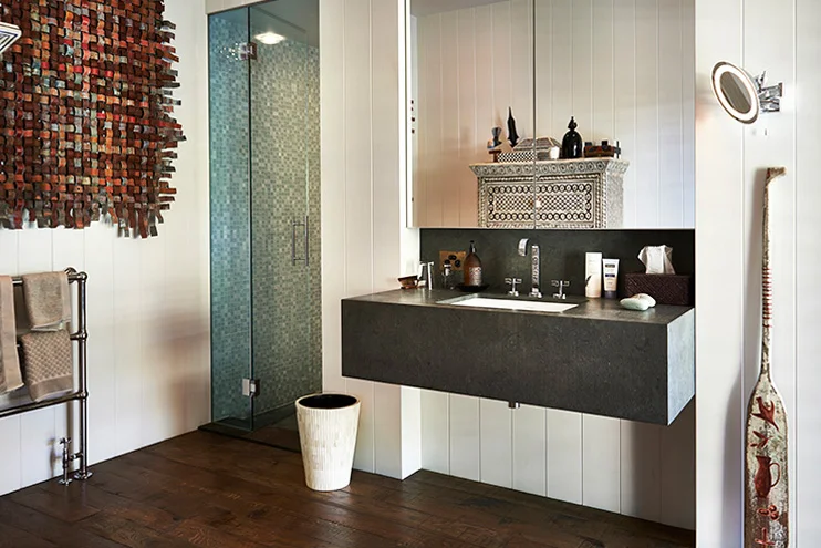 Notice all of the artwork and beautiful details even in the bathroom. I was dying for this chest of drawers which you can see reflected in the mirror. Source