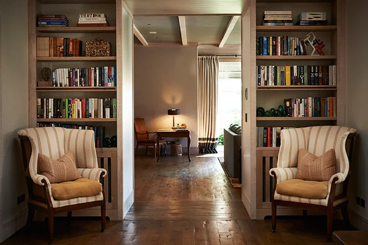 View looking into the great room from the foyer. How gorgeous are those wood floors? Source