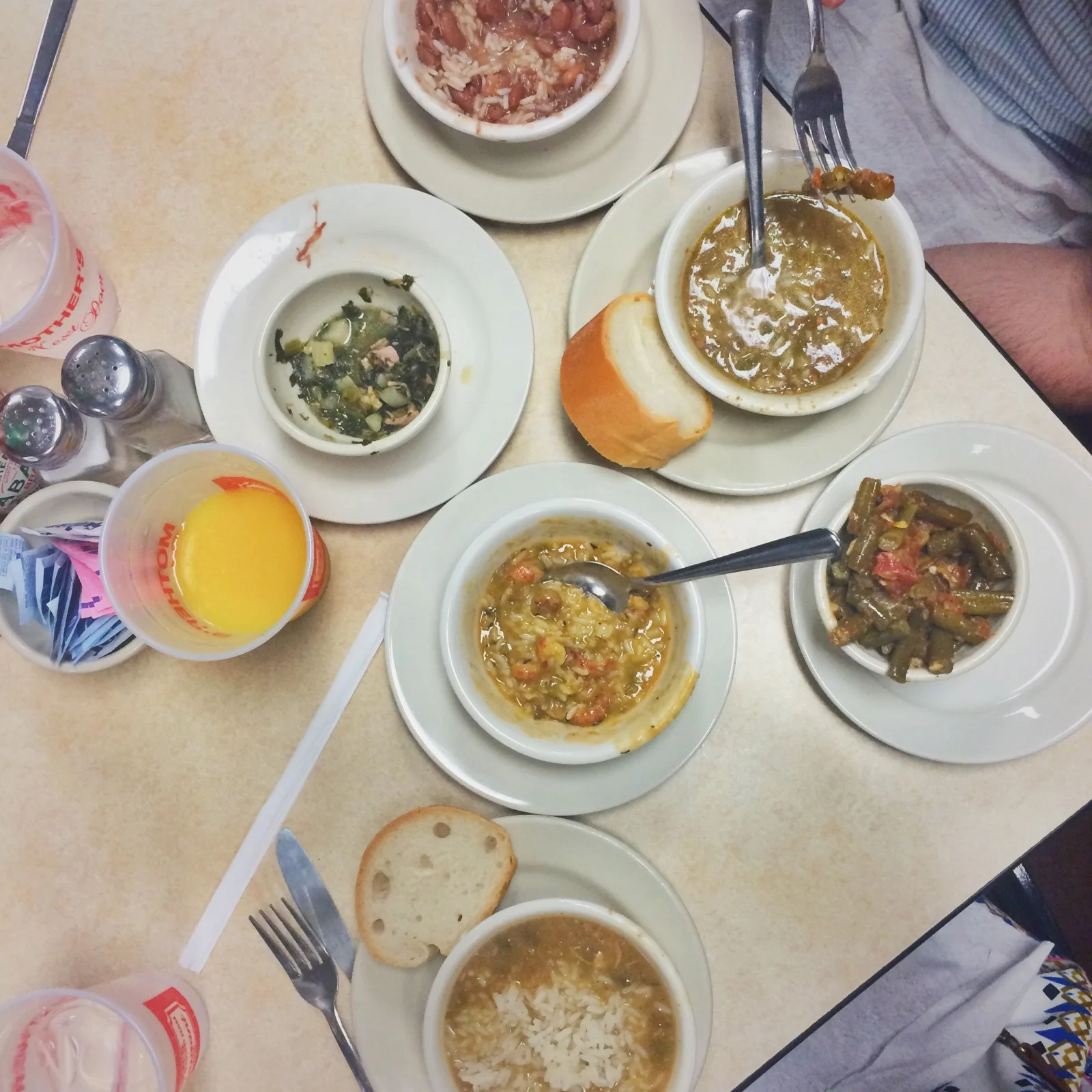 Dining at Mother's. Joe wanted to try them all - Crawfish Etouffee, Chicken & Sausage gumbo, seafood gumbo, red beans and rice and collard greens.