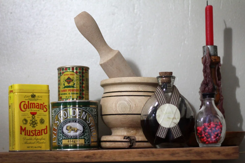 My glass of rosary peas, just sitting on my kitchen shelf near the pestle and mortar, vanilla extract, and curry powder. Who wants to come over for dinner?
