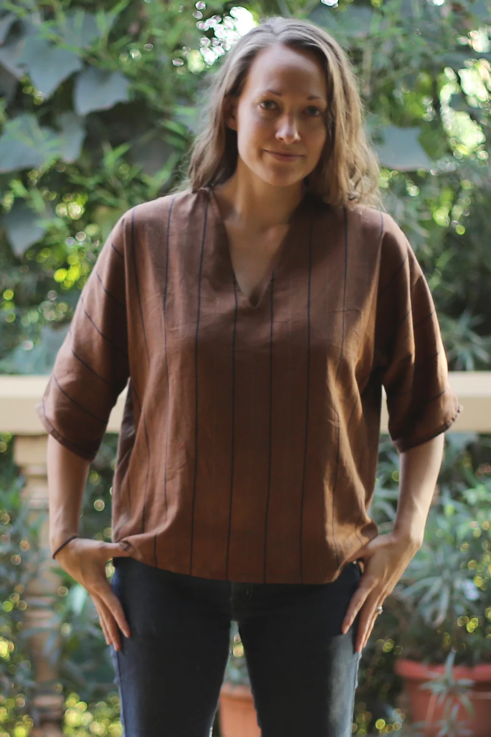 This was originally a floor-length mumu/robe found in a pile at the market. I had the sleeves cut off, and had it hemmed into a shirt and taken in at the sides.