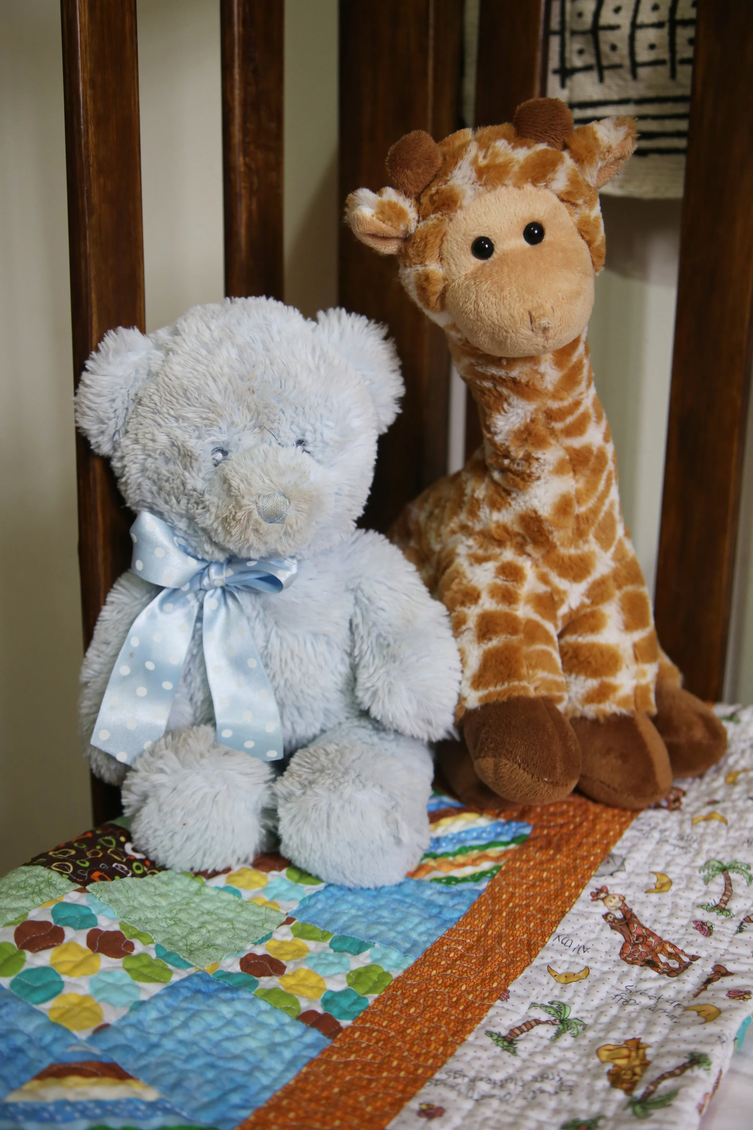 Quilt made by my second cousin. Stuffed animals gifts from Leo's 2 aunts.