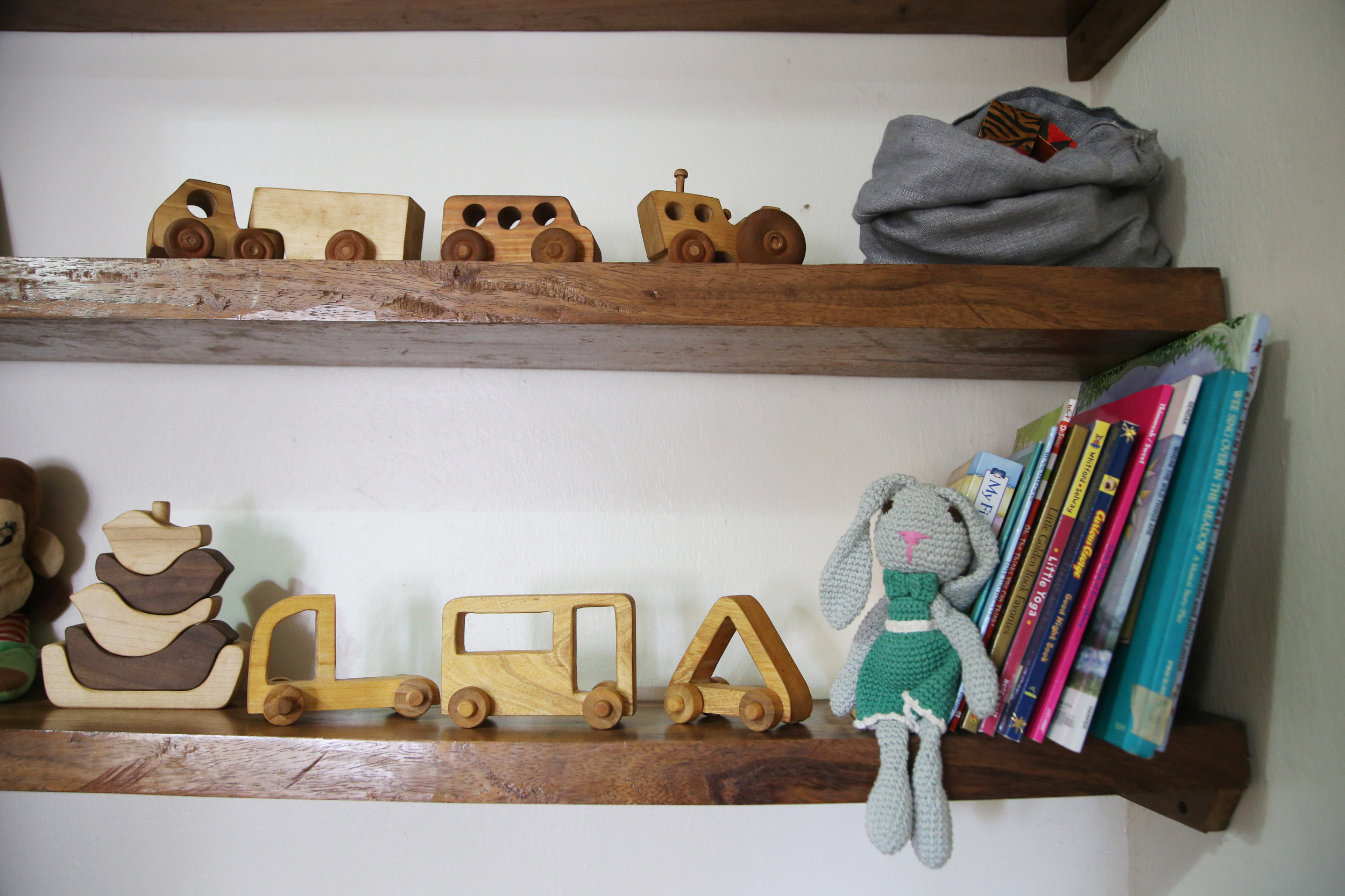 Geometric toy cars and stuffed bunny from Baby Lionheart . Bird stacking blocks from Manzanita Kids . Other toy cars handmade and bought on my trip to Vermont .