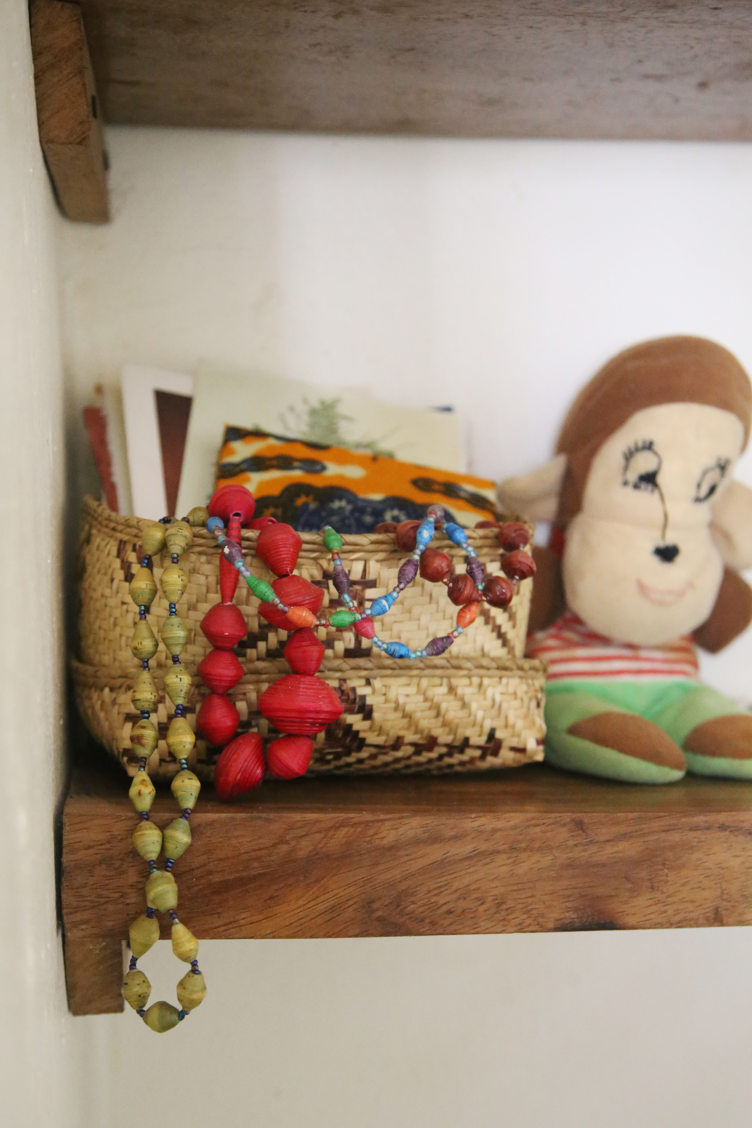 Beads given to me by women at my birthing blessingway. Basket made locally. Stuffed monkey was Eric's when he was a baby.