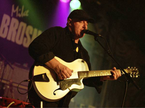 Mike Brosnan, a renowned and exceptional finger-style guitarist, powerful singer, and gifted songwriter, was recording his original tunes.