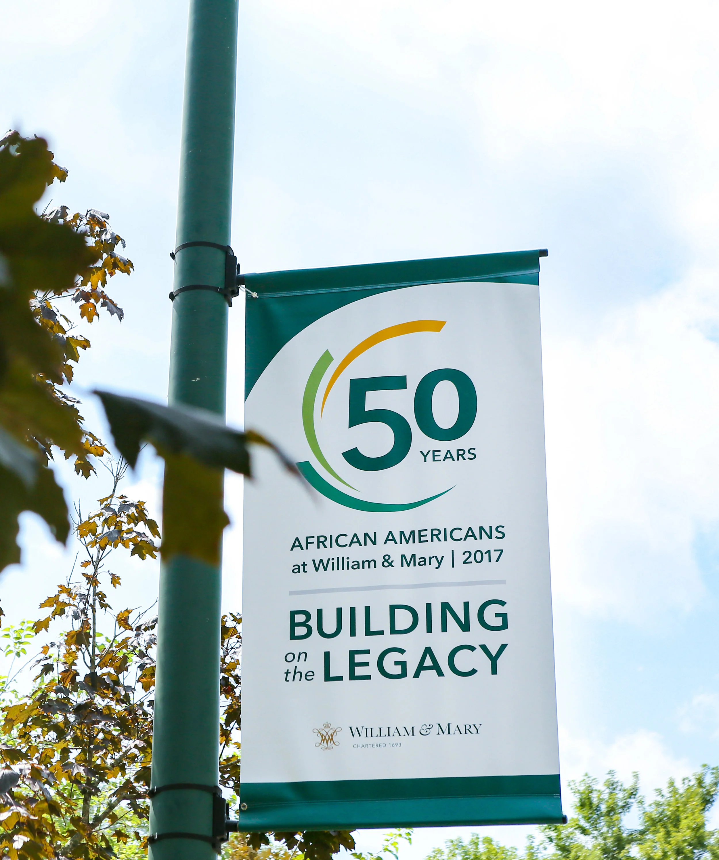 The first three African-American undergraduate, residential students; the past, present and future; the impression of movement and advancement. The fluid shapes that orbit “50 years” in the logo represent many things. 2017 marked the anniversary of enrollment of the first three African-American undergraduates to live on campus. There were also other milestones before it for African-American history at W&M, so the logo needed to represent all those things.