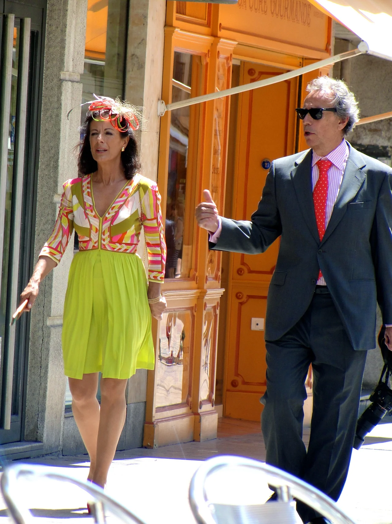 Two of the most fashionable wedding guests I have ever seen. I wish the photo showed her shoes - they were suede pumps that matched the orangey coral color in her dress. I was absolutely in awe of the outfits the women wore to this mid-day summer we…