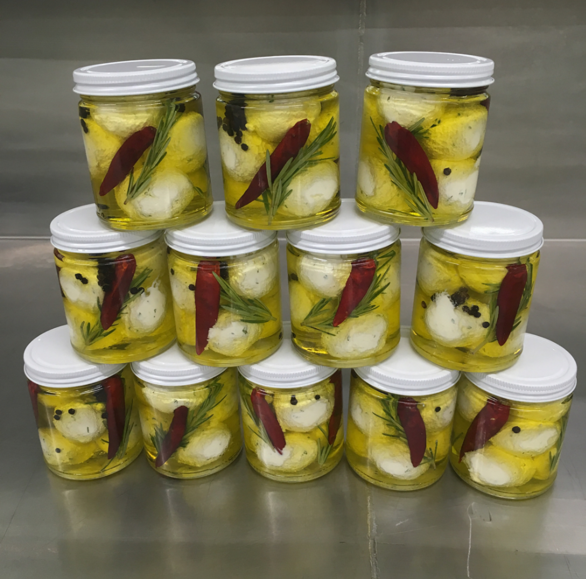 Jars of award winning Marinated Labneh cheese.