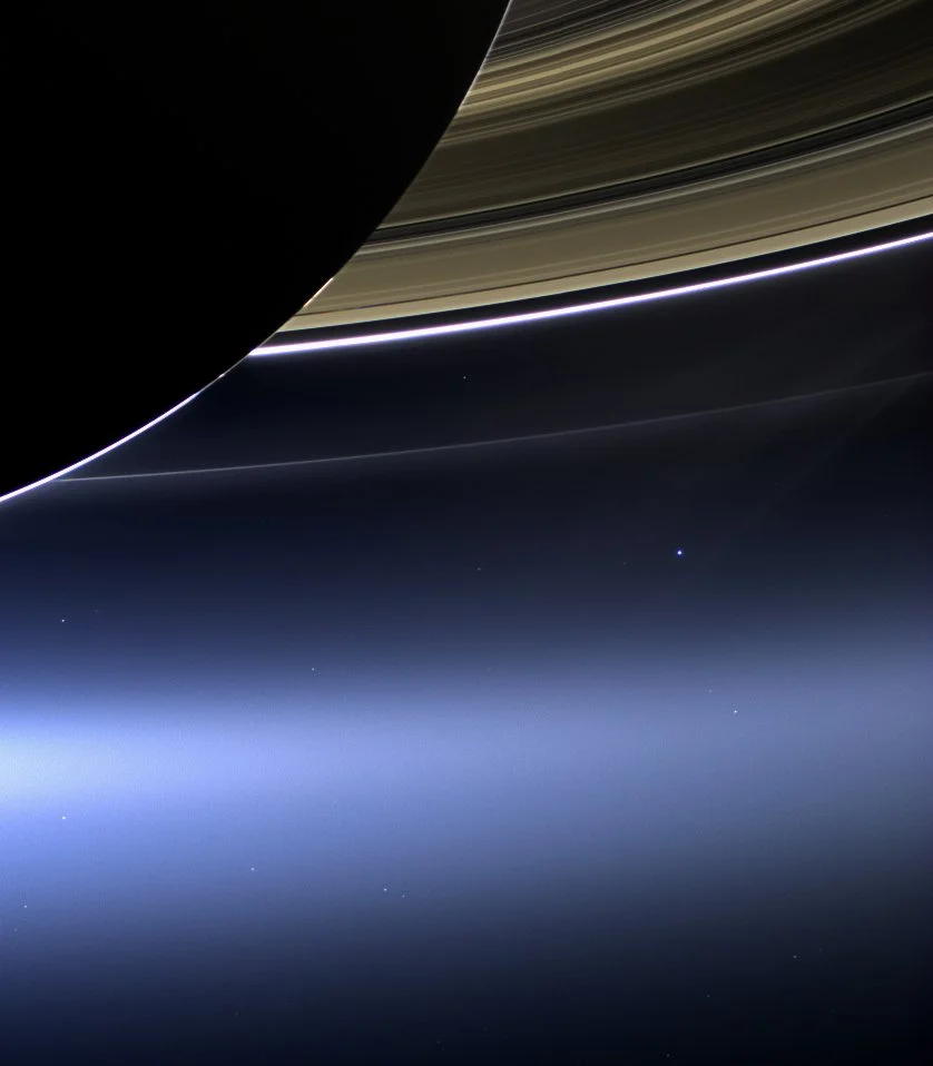 Cassini’s Pale Blue Dot — Earth from Saturn’s Shadow July 19, 2013 The Cassini spacecraft captured this rare and poetic view of Earth and its Moon peeking through the rings of Saturn from a distance of over 1.4 billion kilometers. Framed amid