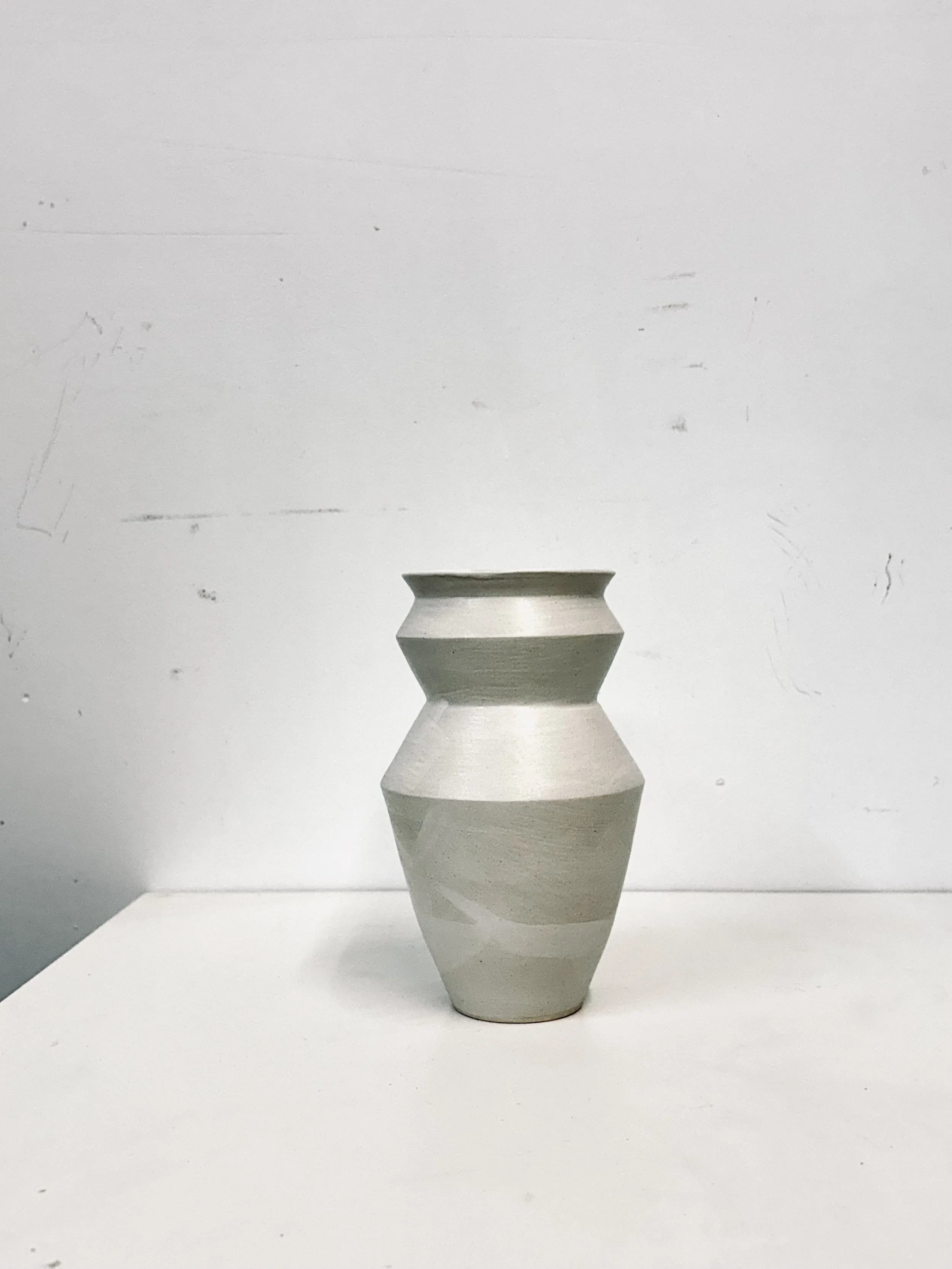simple white stone vase
