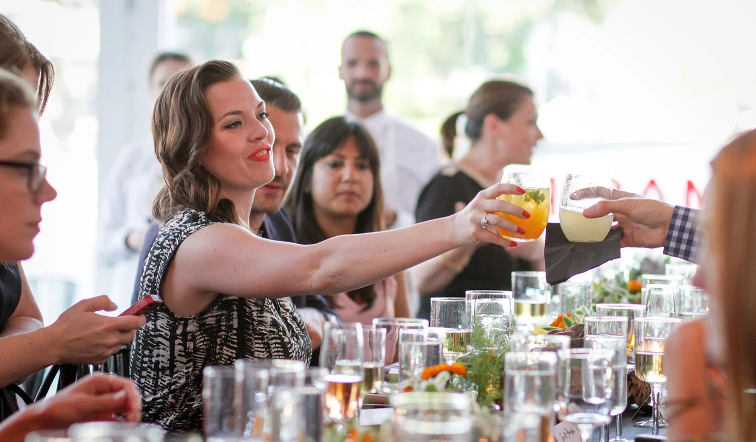A lovely guest enjoying a cocktail at the Preti pop-up.