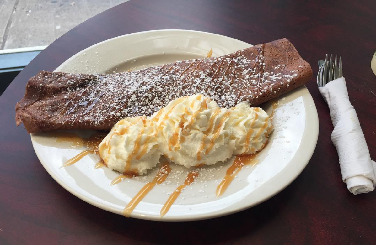 Double chocolate strawberry crepe, served with whipped cream and caramel drizzle