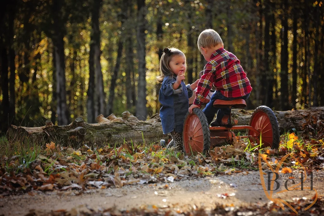 This is my favorite shot from the whole session. They are having a very serious conversation about who is suppose to be on the tractor and who is suppose to be on the other side of the road having their picture taken. So glad I turned towards them just in time to capture this moment. 