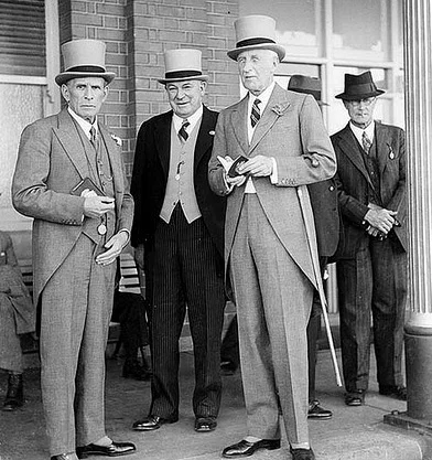 1937 The Sydney Cup. Top hat and tails. Details: pocket watches and FOBs.