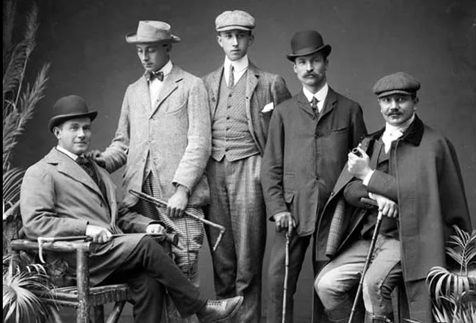 Est. 1903 at the Imperial Hotel. A group of dapper gents, looking very confident. All of the distinct styling details: Velvet collar, rounded collar with collar bar, bow tie, pocket square....these fellas have it goin' on!
