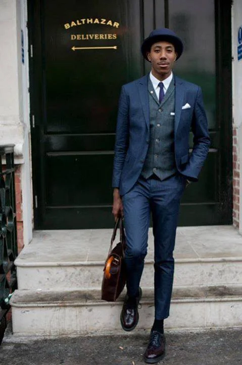 This well dressed fellow has it all put together perfectly. Proportion, lapel detail, a bit conservative on the Pocket Square, mostly likely he had a serious business meeting, you can always switch out that detail for after hours.