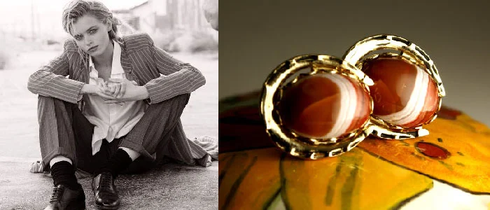 Featured are a pair of polished stone horseshoe cufflinks.