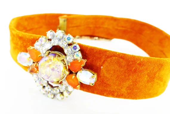 Czech glass magnetic brooch "Chick Magnet" Mag TAK. Shown being used as a leather suede choker necklace embellishment.