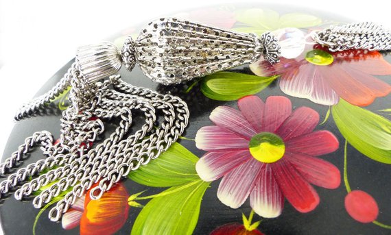 Silver chain tassel & bell multi strand necklace