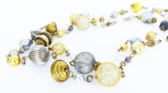Bauble extra long strand necklace. Metal mesh covered beads in silver and gold