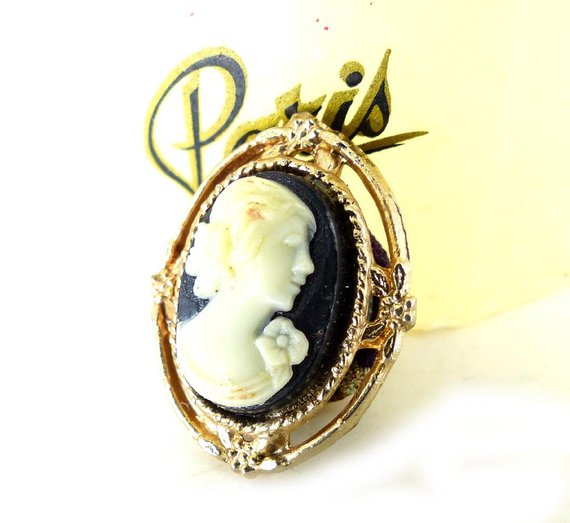Vintage black & cream profile cameo with rose magnetic brooch set in an open gold floral frame