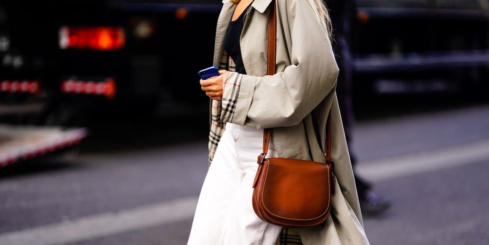 guest-wears-a-brown-leather-bag-and-a-trench-coat-outside-a-news-photo-1628697124.jpg