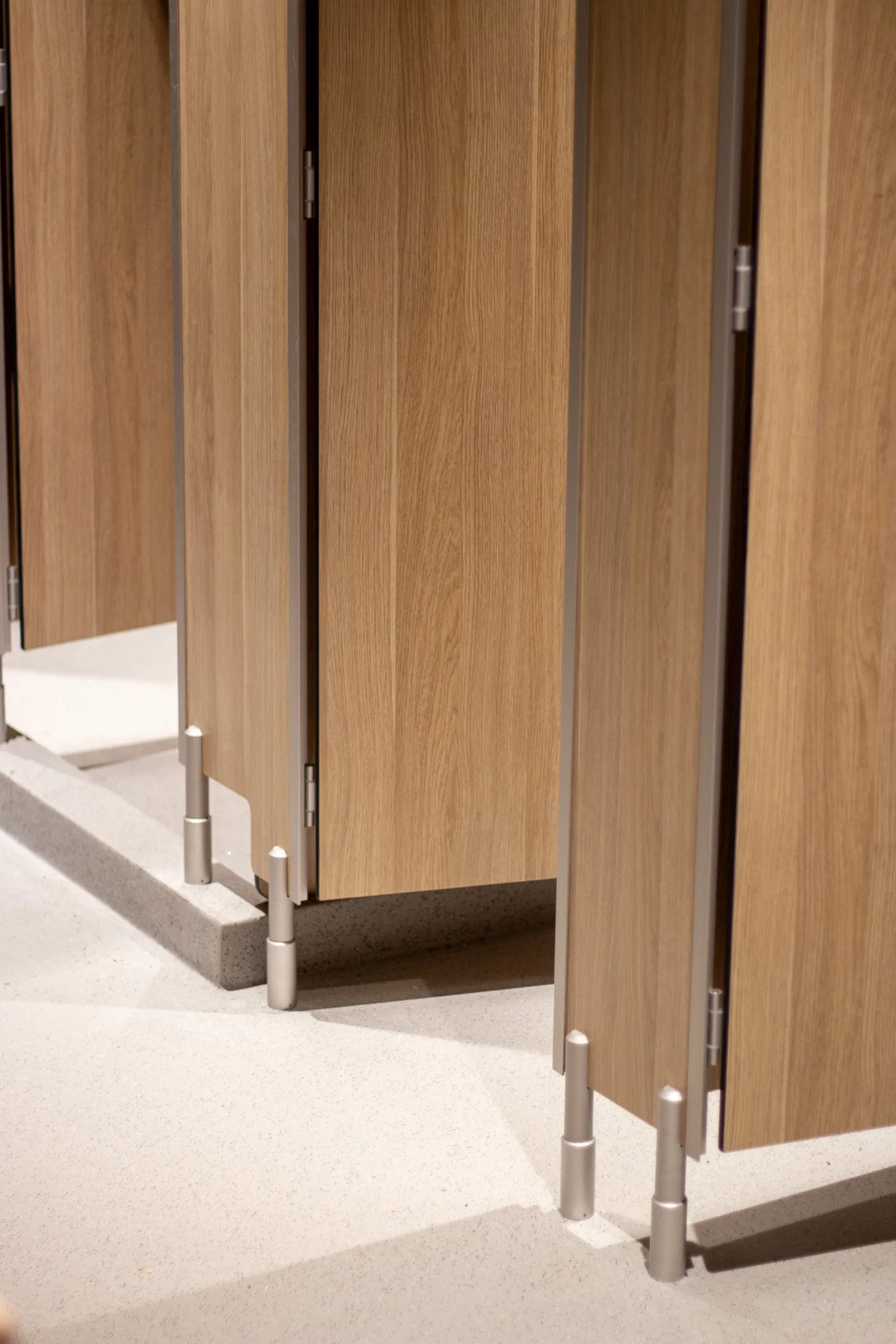 Picture from the outside of Freeform toilet Cubicles showing the feet and the shower tray