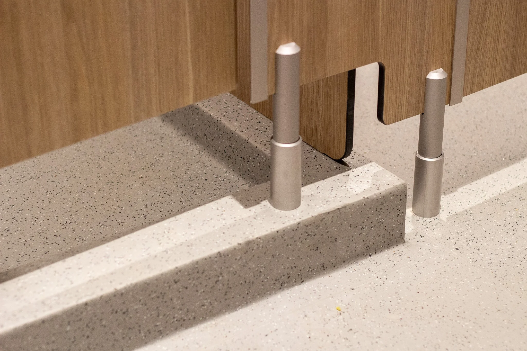 Outside View of a shower and toilet. A close up of the bottom corner