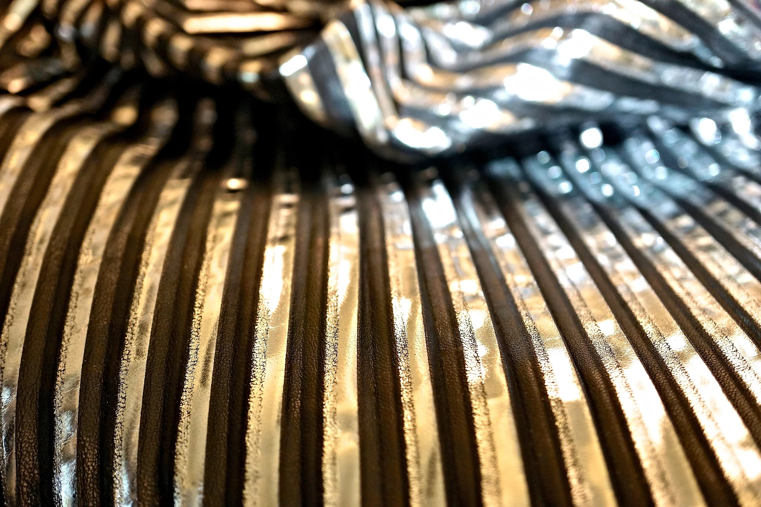 Pleated silver on black