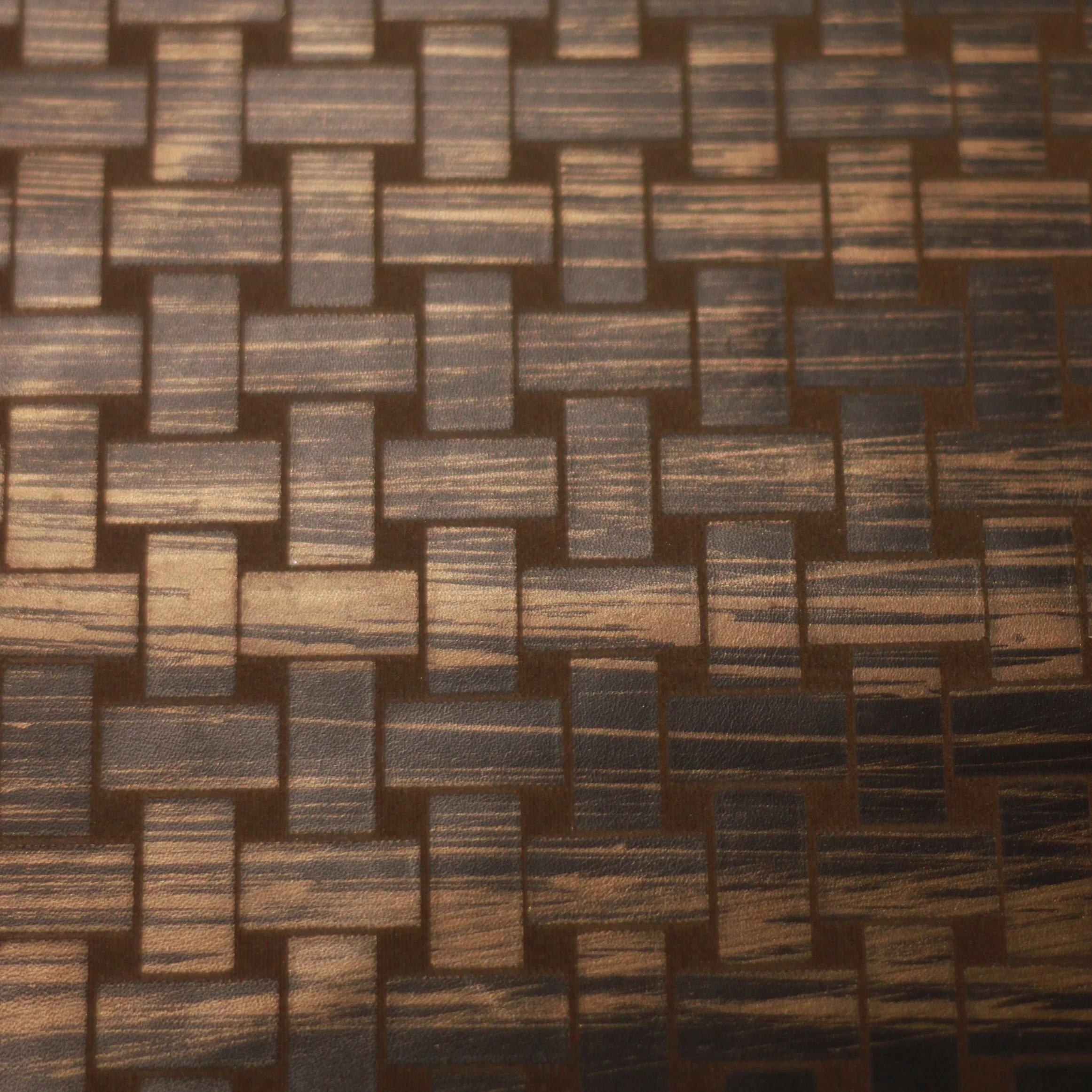 etched & engraved technique  with mondo hand-painted bronze on Maude leather in clove #069.980.bcd.03.g.135