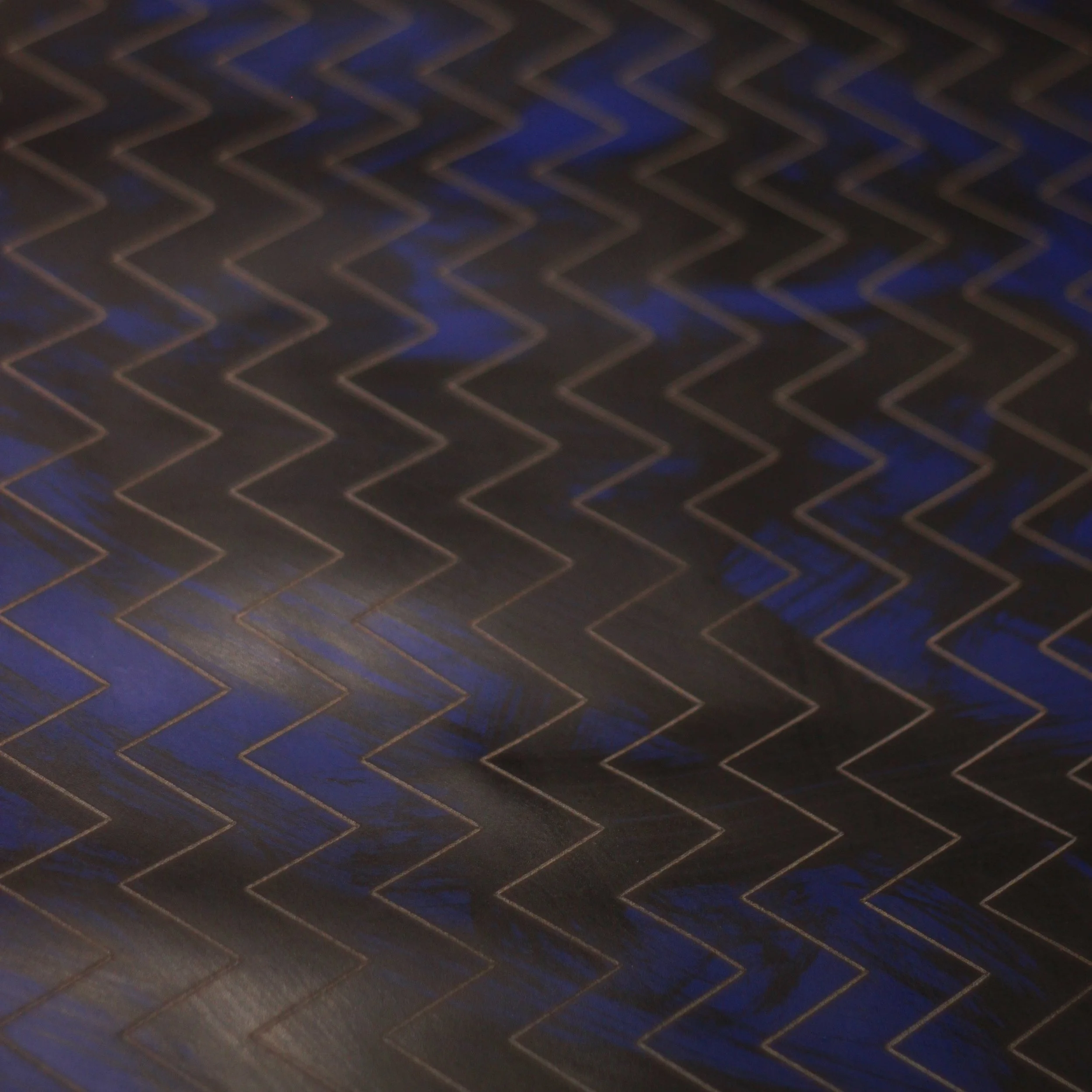 etched  on Maude leather in lupin with black brushed paint