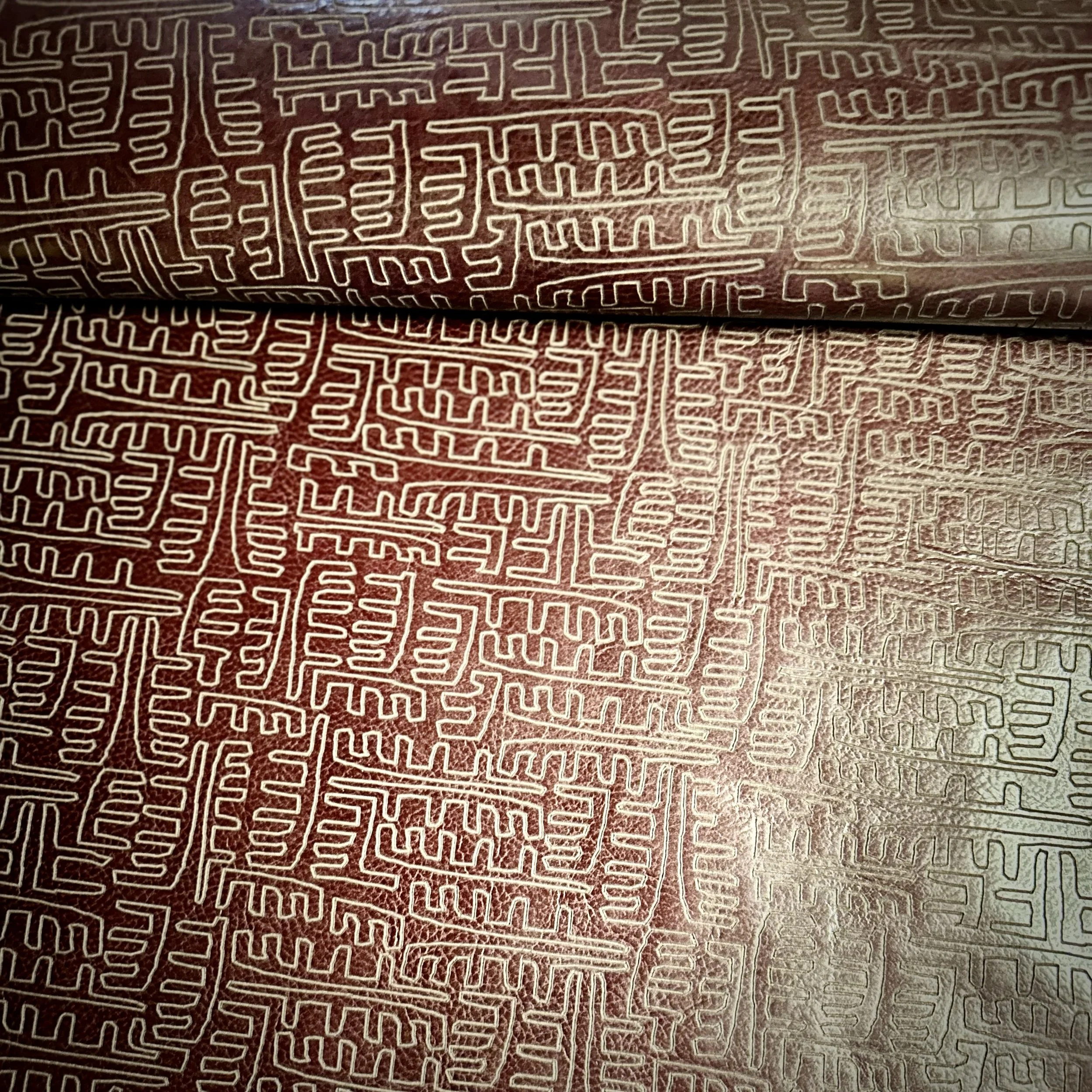 etched on Maude leather in eggplant