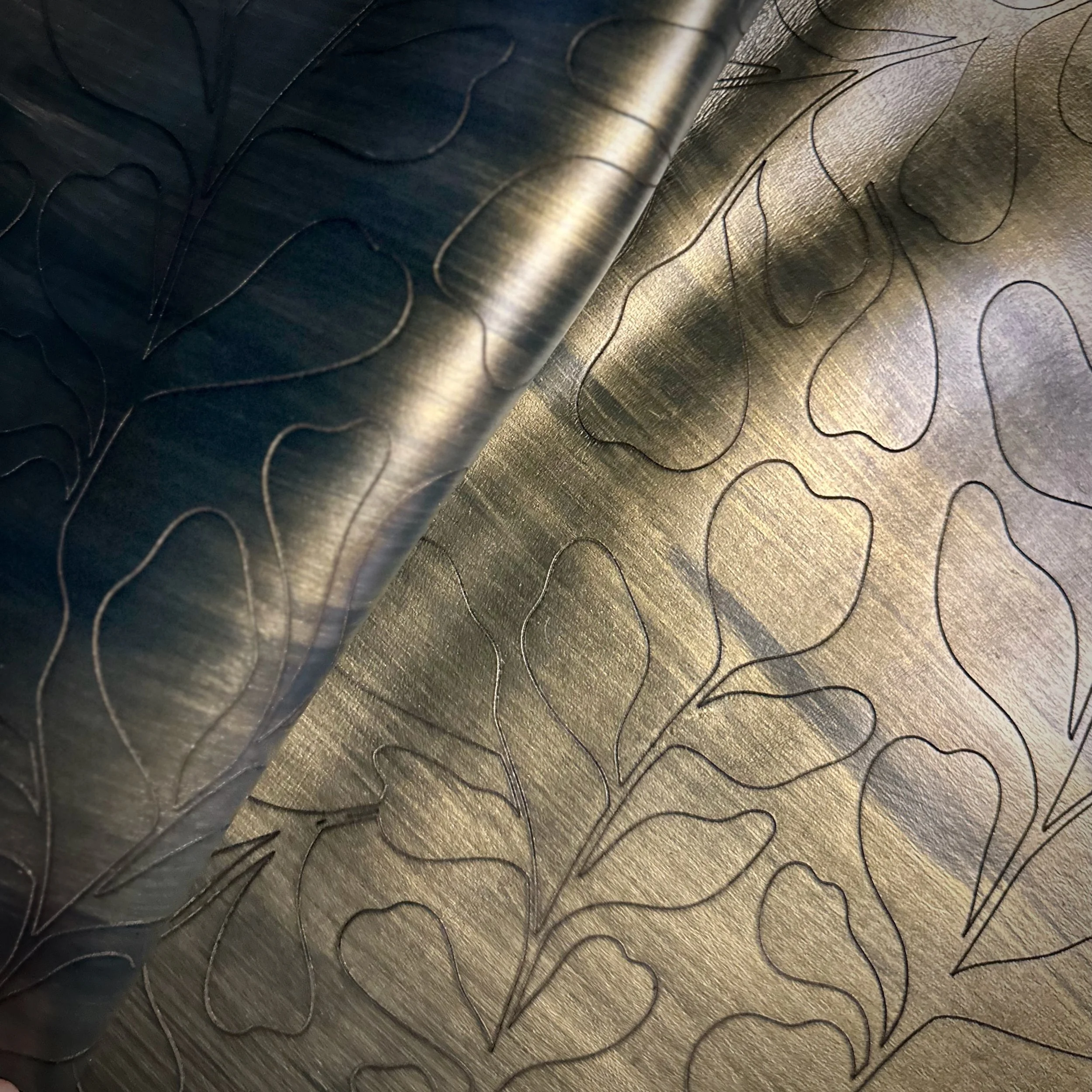 etched on Maude leather in clove with bronze modo paint