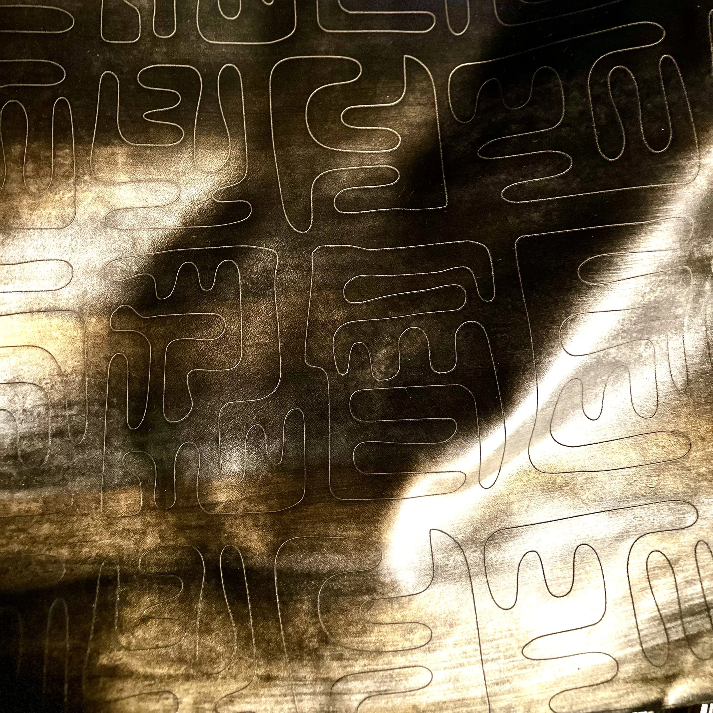 etched on Andromeda ombre finished Maude leather in clove